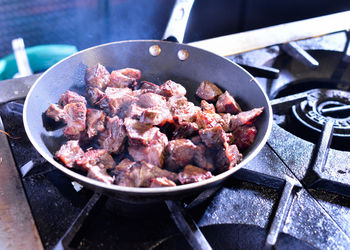 Close-up of meat in cooking pan