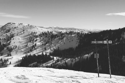 Scenic view of snow covered mountains against sky