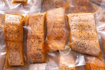 Freeze cooked salmon in vacuum packs on grunge table, concept of food preservation