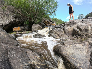 Full length of man standing on rock