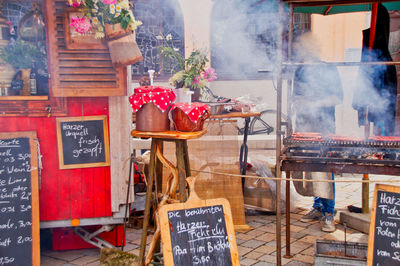 Text on display at barbecue store at market