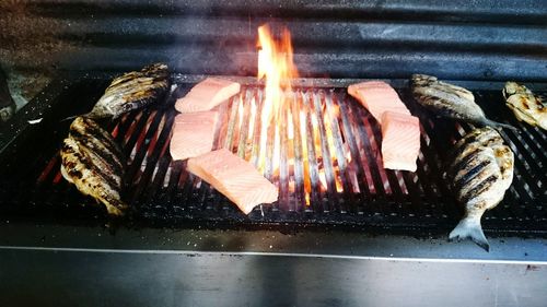 Close-up of meat on barbecue grill