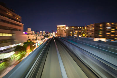 High angle view of light trails on road at night