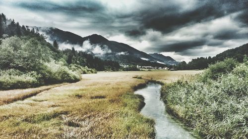 Scenic view of landscape and mountains against sky