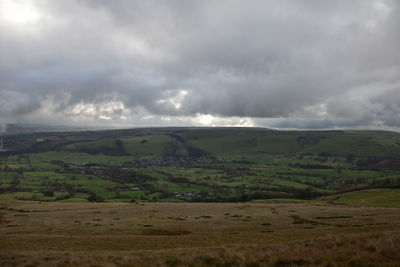 Scenic view of agricultural landscape against sky