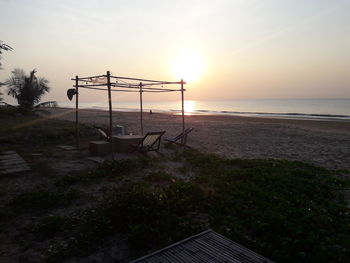 Scenic view of beach against sky during sunset