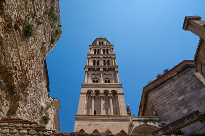 Low angle view of a building against blue sky