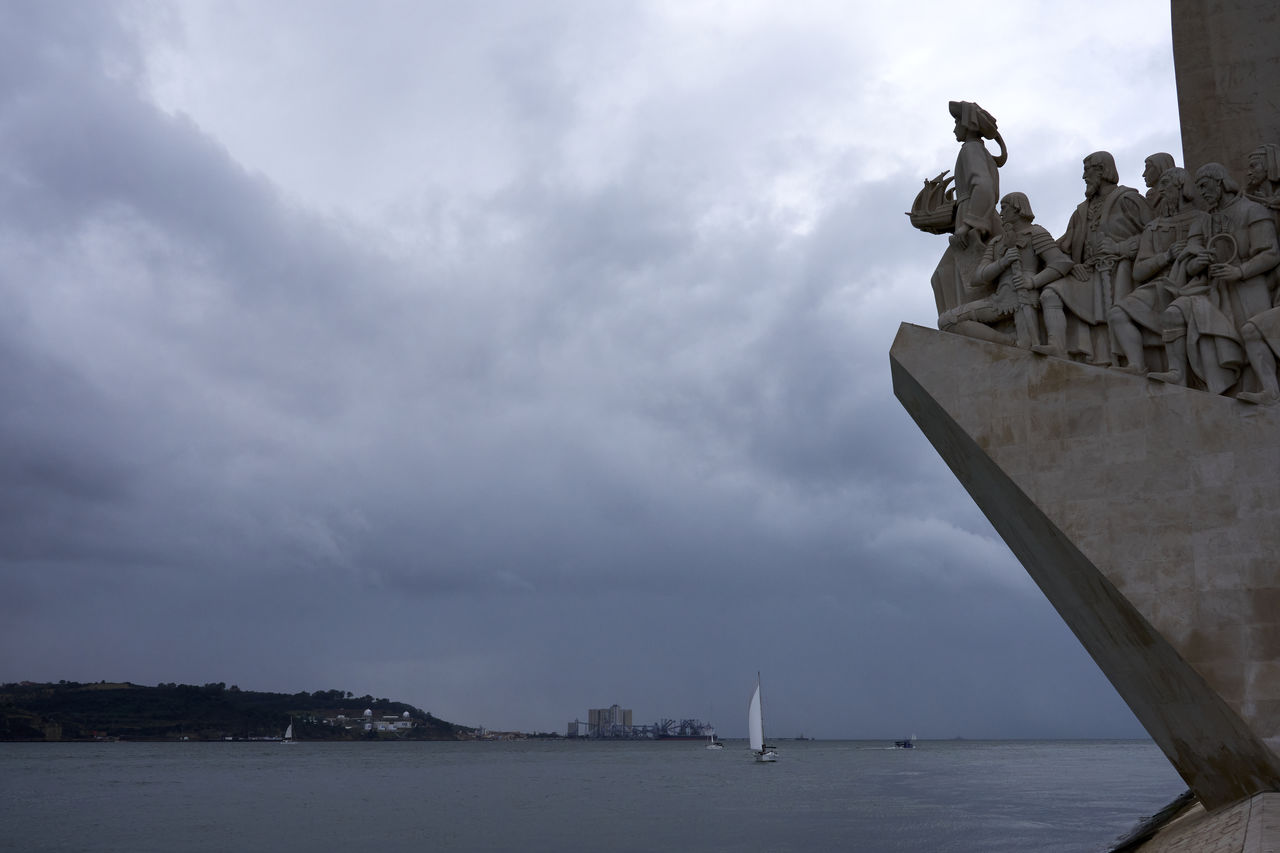 cloud, sky, water, architecture, nature, sea, sculpture, craft, statue, nautical vessel, vehicle, travel destinations, representation, transportation, built structure, outdoors, no people, history, travel, overcast, the past, day, ship, coast, creativity, environment