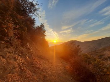 Scenic view of landscape against sky during sunset