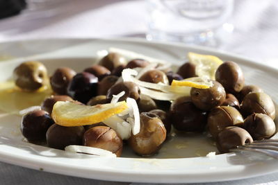 Close-up of fruits in plate on table