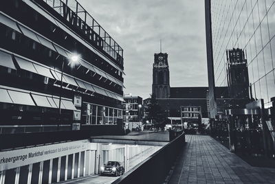 Street amidst buildings against sky in city