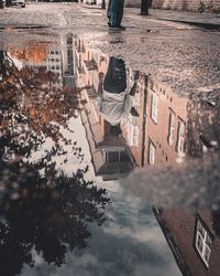 Reflection of buildings in puddle