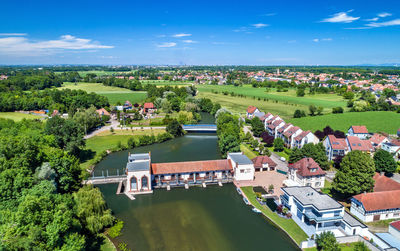 High angle view of houses and buildings against sky