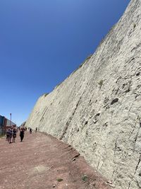 People walking on mountain road