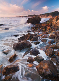 Scenic view of sea against sky during sunset