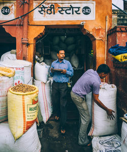 Woman standing in front of shop