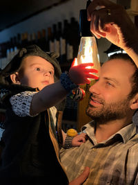 Portrait of smiling man holding camera
