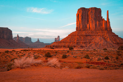 View of rock formations on landscape against sky