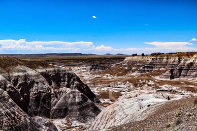 Scenic view of landscape against blue sky