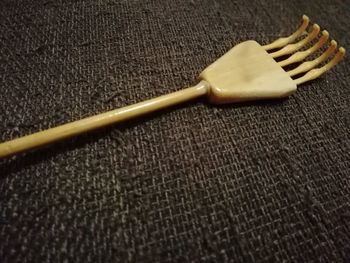 High angle view of fork on table