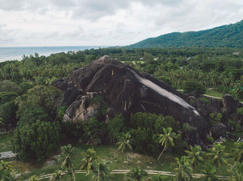 Scenic view of land and sea against sky