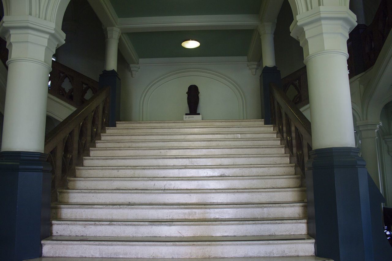 LOW ANGLE VIEW OF STAIRS ALONG WALLS