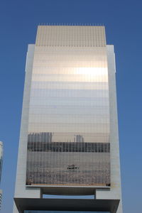 Low angle view of skyscraper against clear sky