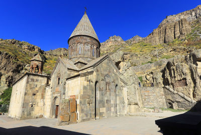 Panoramic shot of historic building against clear blue sky