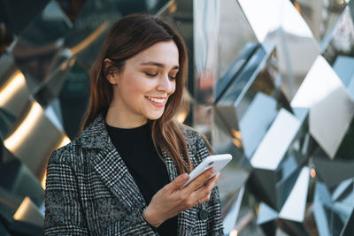 Young woman using mobile phone