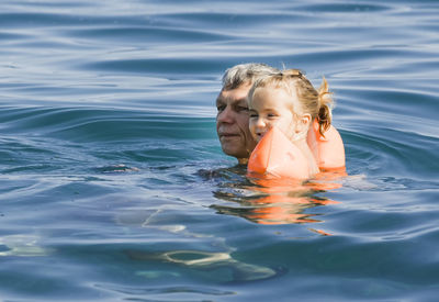 Portrait of girl swimming in sea