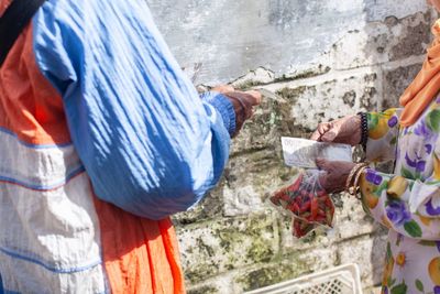 Rear view of people working at temple