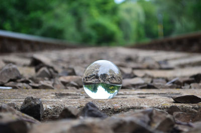 Close-up of a crystal ball on rock