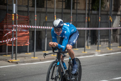 Man riding bicycle on road