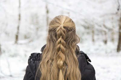 Close-up rear view of woman with blonde hair