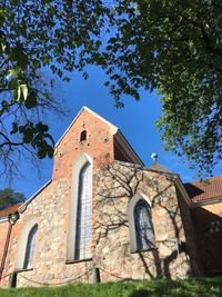 Low angle view of building against clear blue sky