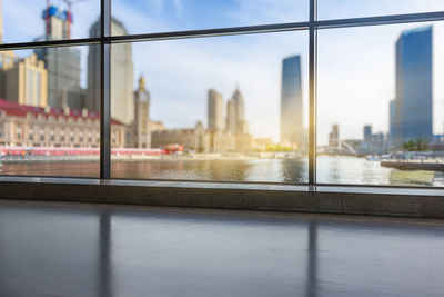 View of city buildings seen through window