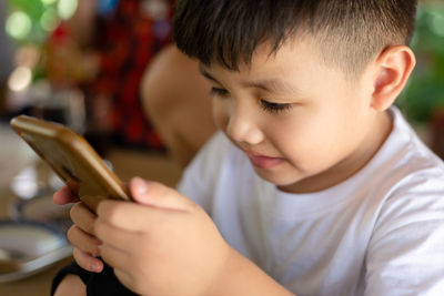 Close-up of boy looking at camera