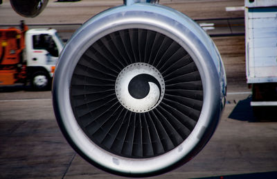 Jet engine of airplane at airport runway