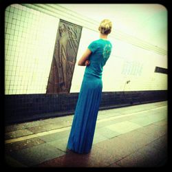 Full length of woman standing by railing