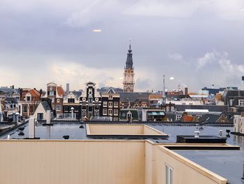 View of buildings against cloudy sky