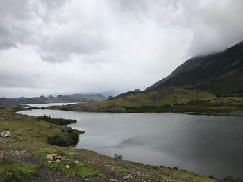 Scenic view of lake and mountains against sky