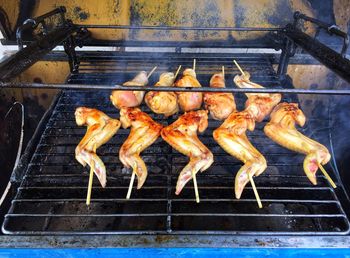 Close-up of meat on barbecue grill