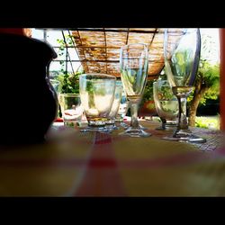 Close-up of wine glasses on table