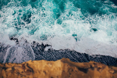 Scenic view of sea waves splashing on rocks