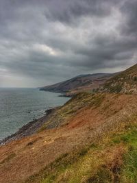 Scenic view of sea against cloudy sky