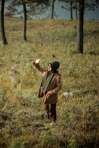 Woman standing on field