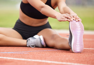 Low section of woman exercising in gym