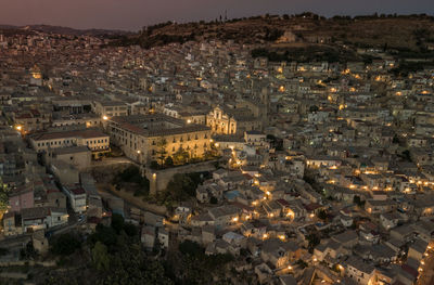 High angle view of illuminated buildings in city