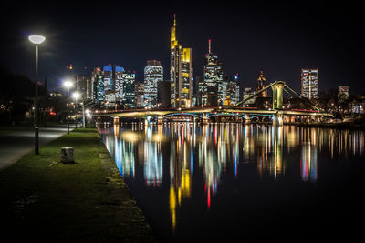 Illuminated city at waterfront