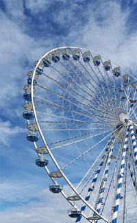 Low angle view of ferris wheel against sky